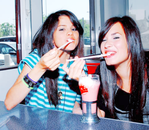 Selena Gomez and Demi Lovato sharing a Milkshake picture by iceypaws123 - 