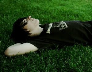 Guy laying on the grass Pictures, Images and Photos